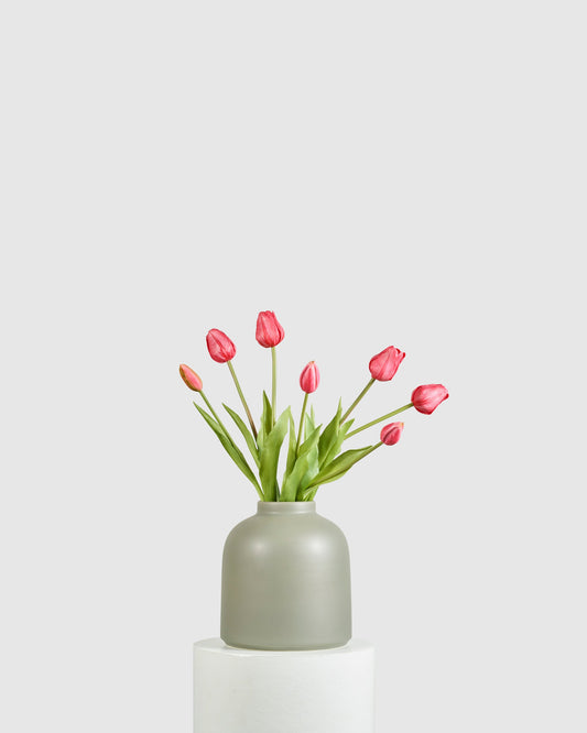 Raawii Omar Vase Smoke Green styled with pink tulips